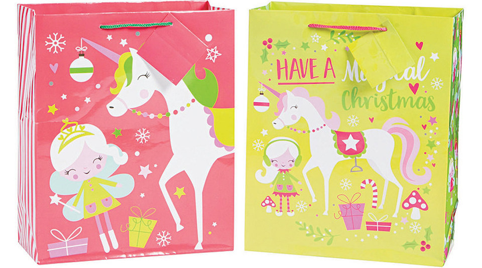two holiday gift bags with unicorns