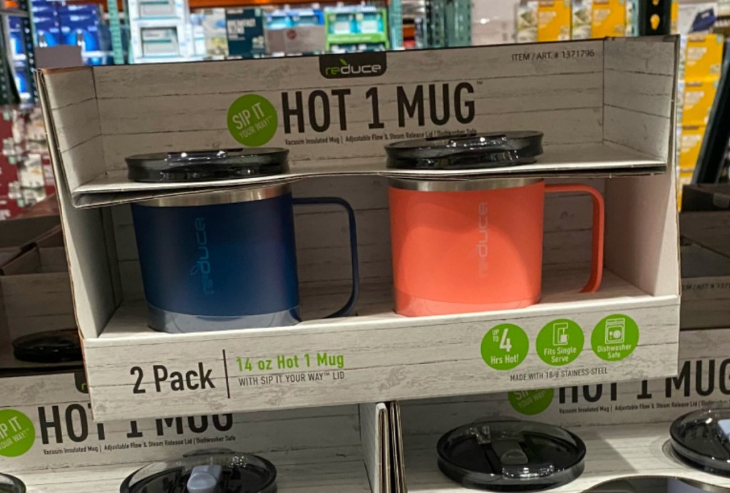 Two colorful mugs in a package on display in-store