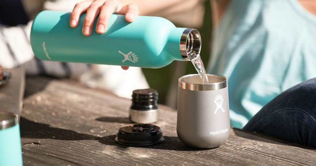 person pouring into a Hydro Flask Wine Tumbler