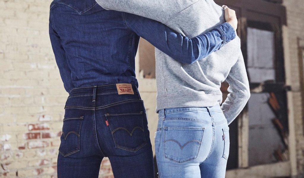 two women wearing Levi's jeans with their backs turned