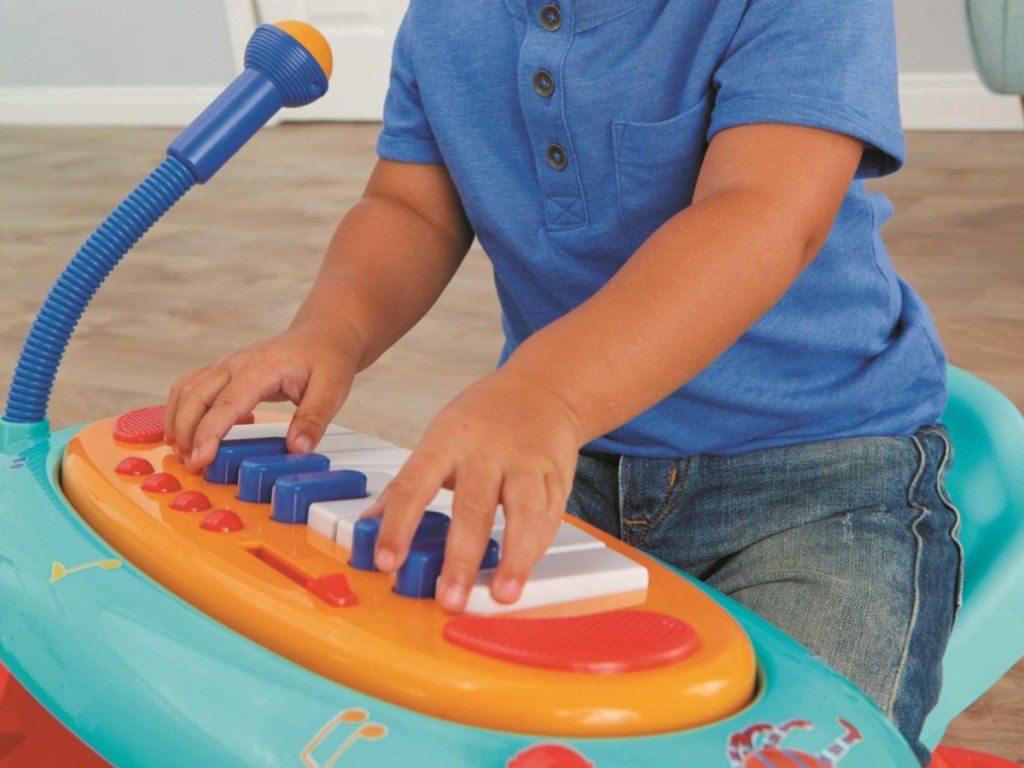 little boy playing with Little Tikes Little Baby Bum Sing-Along Piano
