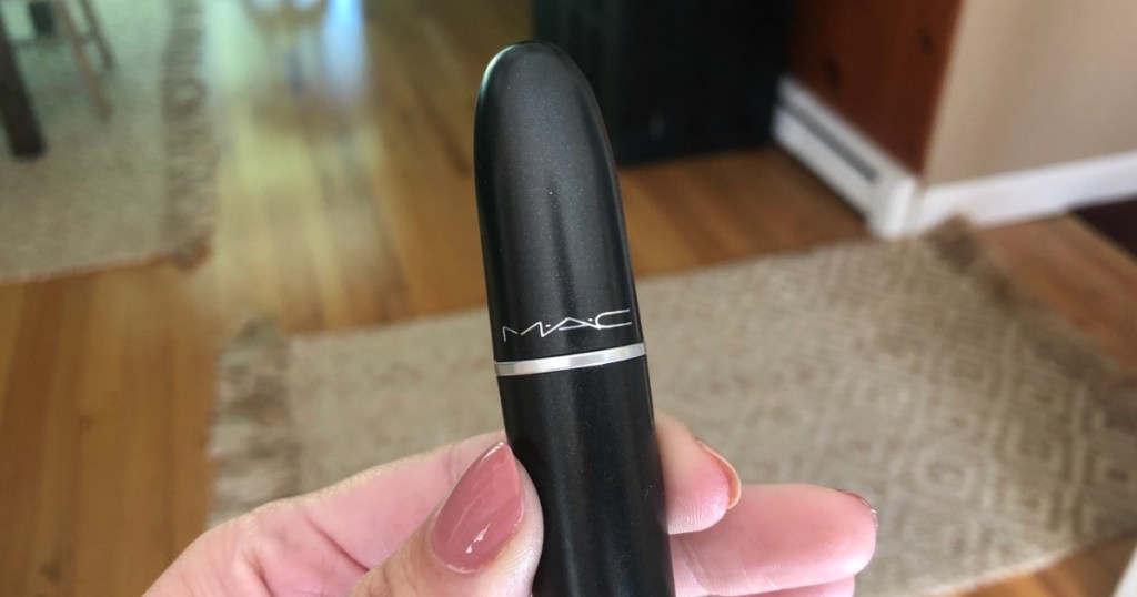 hand holding MAC lipstick