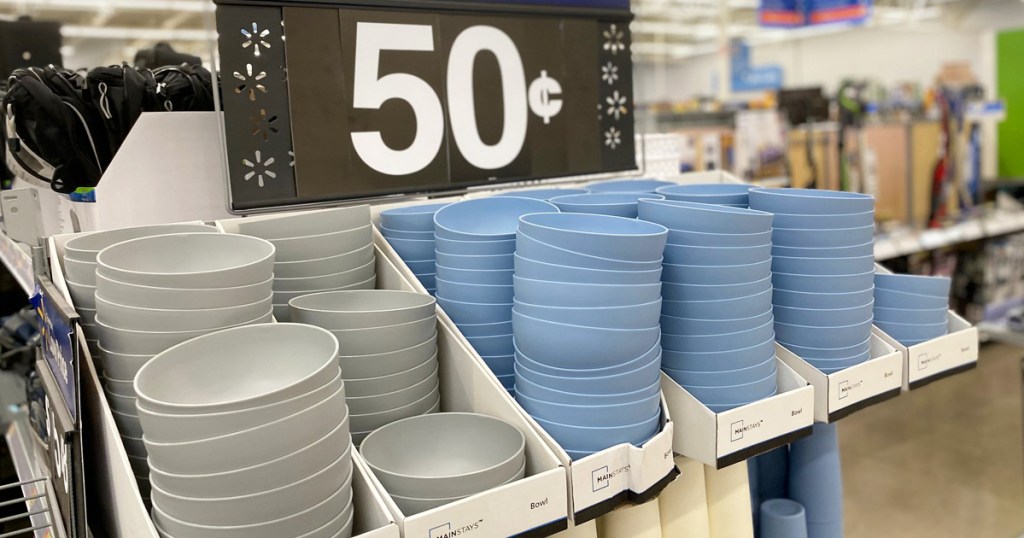 stacks of light grey and light blue plastic bowls on store display shelf