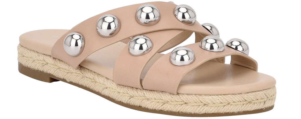 tan flat sandal with silver ball on top of straps