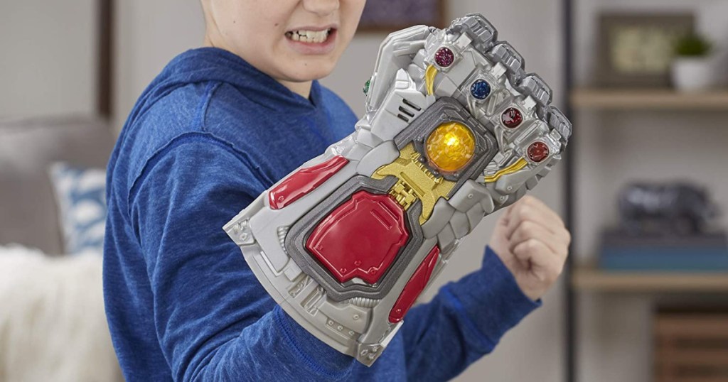 boy wearing a blue long sleeve shirt wearing Marvel Avengers: Endgame Electronic Fist Roleplay Toy on arm