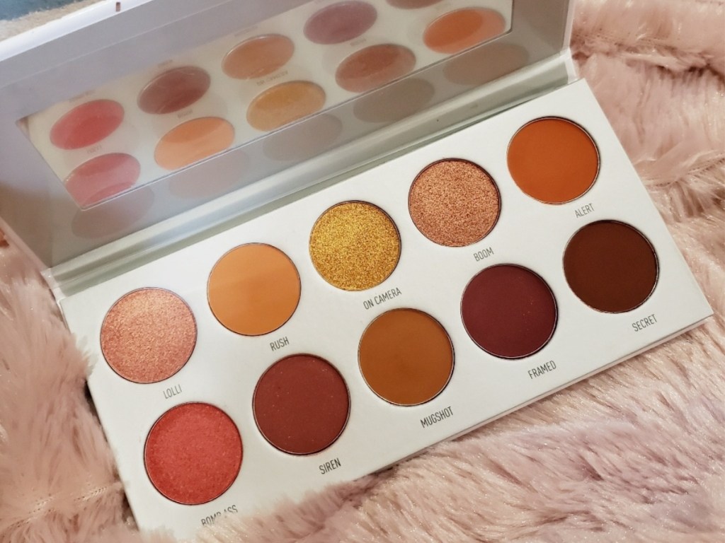 makeup palette on furry pink surface