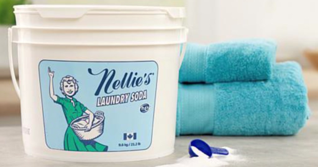 Nellies Washing Soda Bucket sitting in front of teal towels 