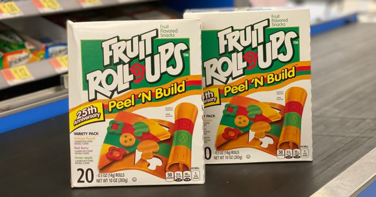 two boxes of fruit snacks on conveyor belt in store