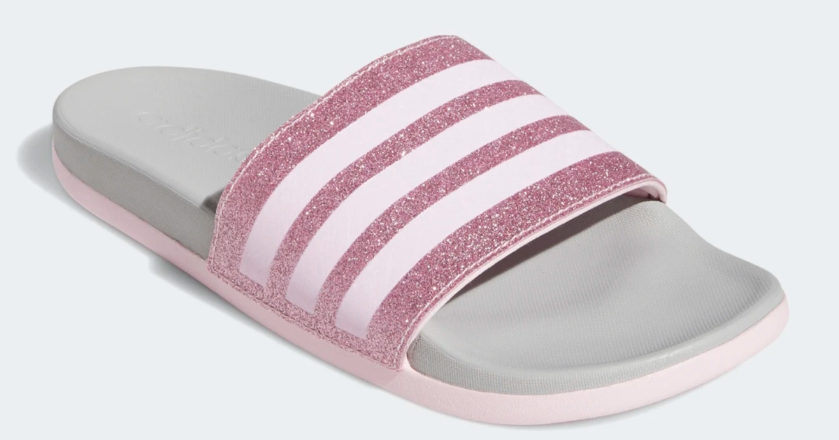a single pink sparkle adidas slide