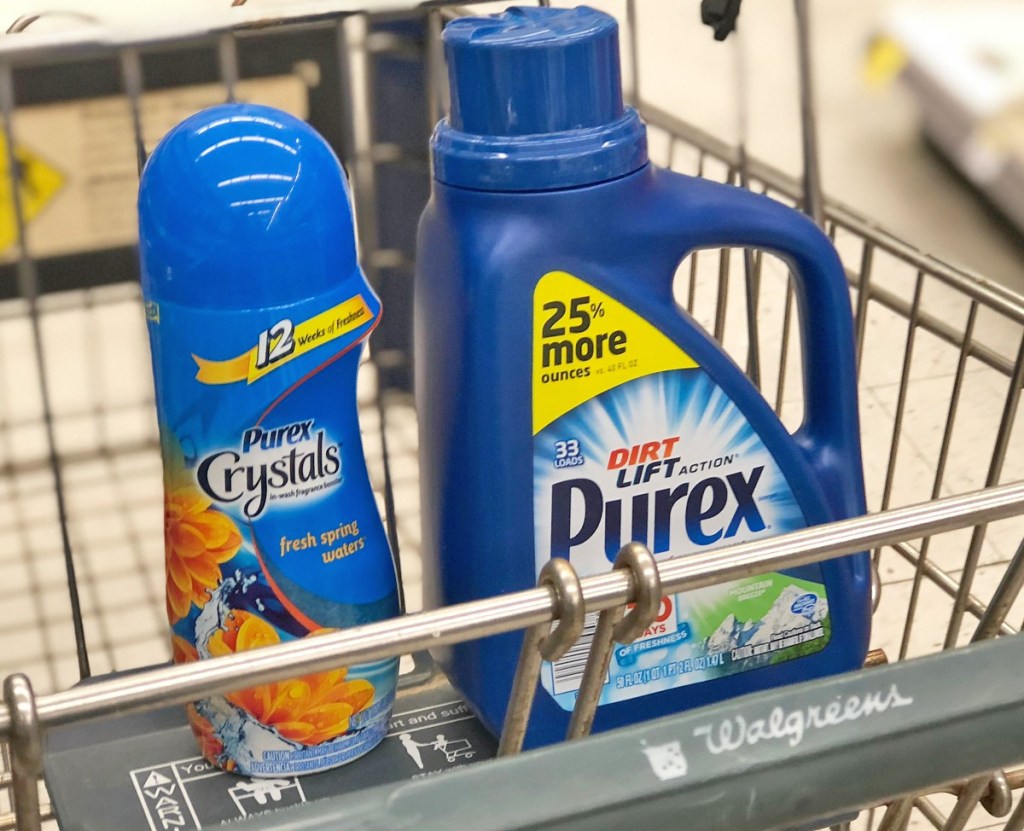 blue bottles of purex laundry crystals and laundry detergent sitting in walgreens shopping cart