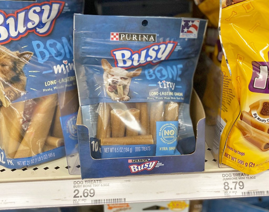 blue package of small purina busy bones on store display shelf