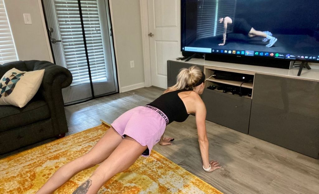 Woman doing a home workout in living room