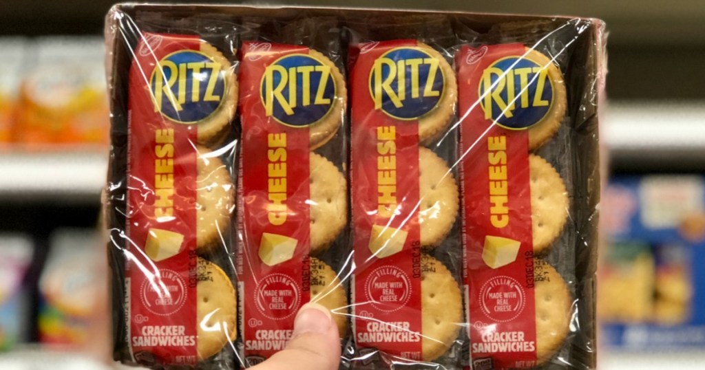hand holding package of Ritz cheese crackers