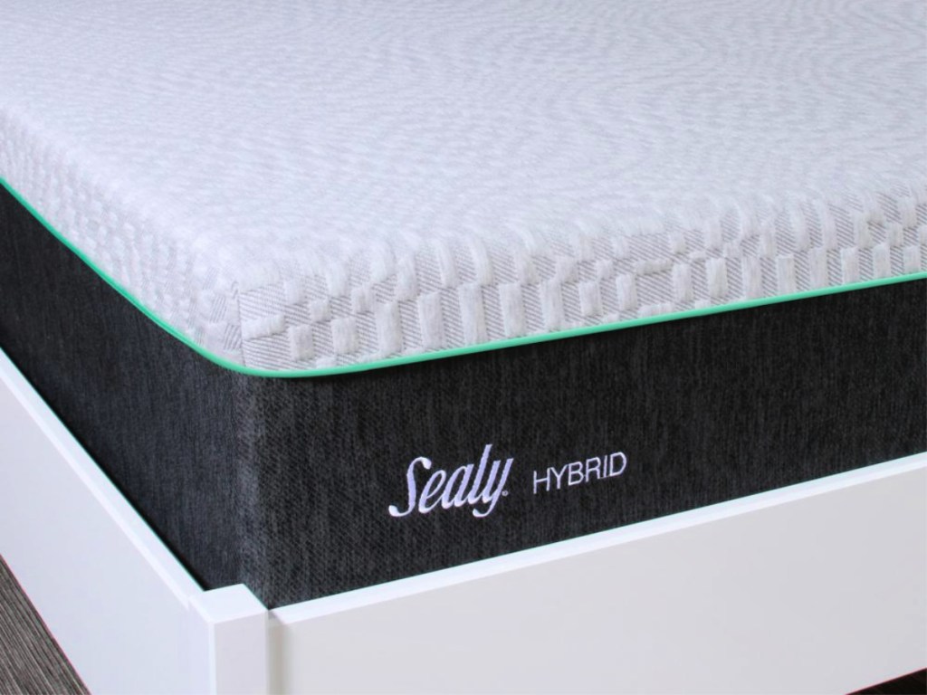 Sealy Spring & Memory Medium-Firm Foam Hybrid Mattress on frame