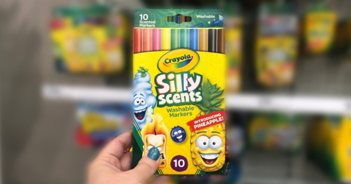 woman hand holding crayola thin silly scents