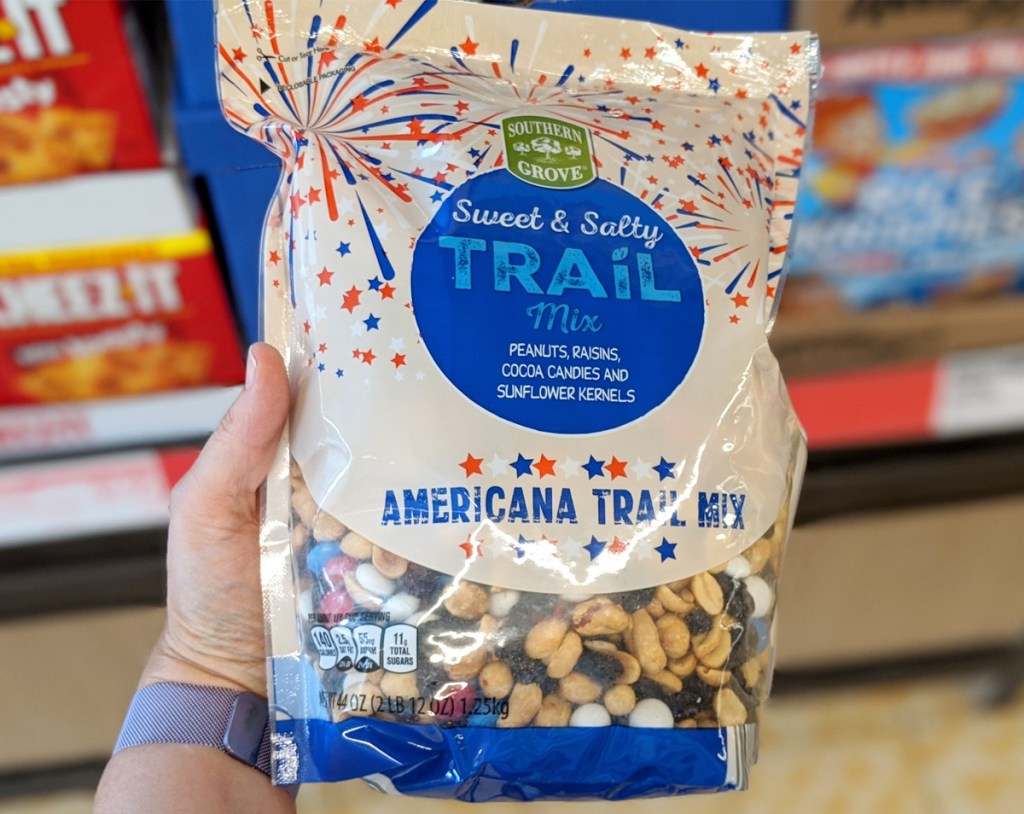 person holding a bag of patriotic themed trail mix