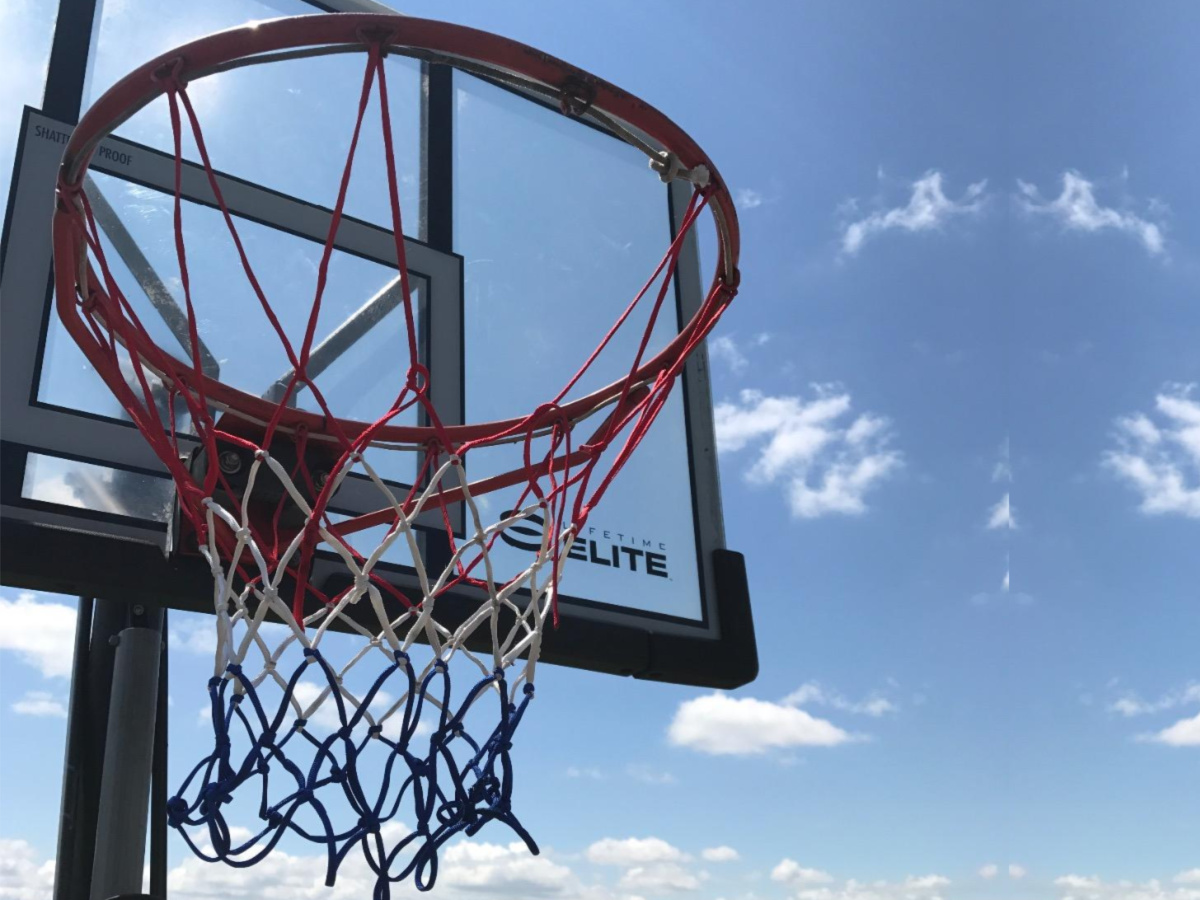 red, white, and blue basketball net outside
