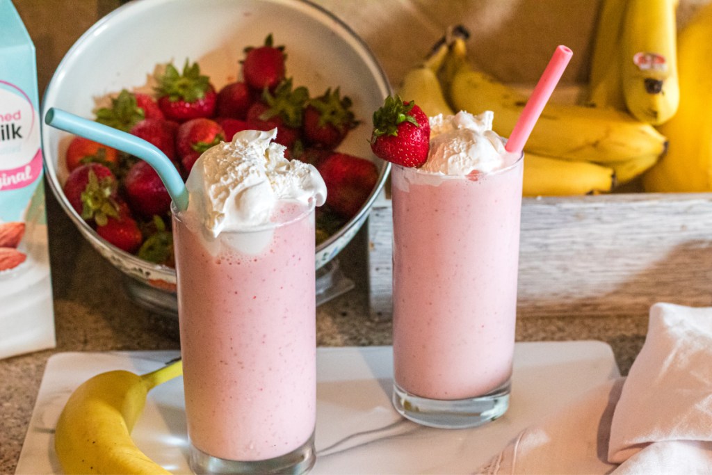 two strawberry banana smoothies on the counter