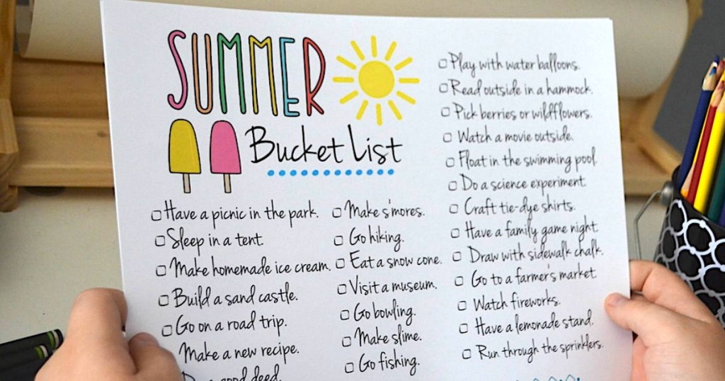 holding free Summer Bucket List printable 