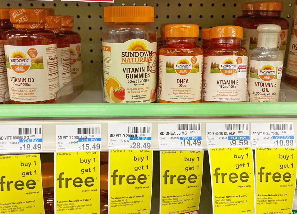 orange bottles of sundown brand vitamins on store shelf
