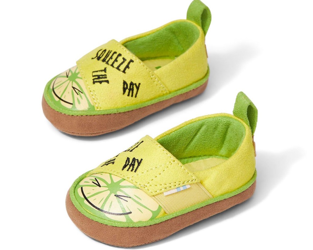 pair of yellow and green baby shoes with lemons on them