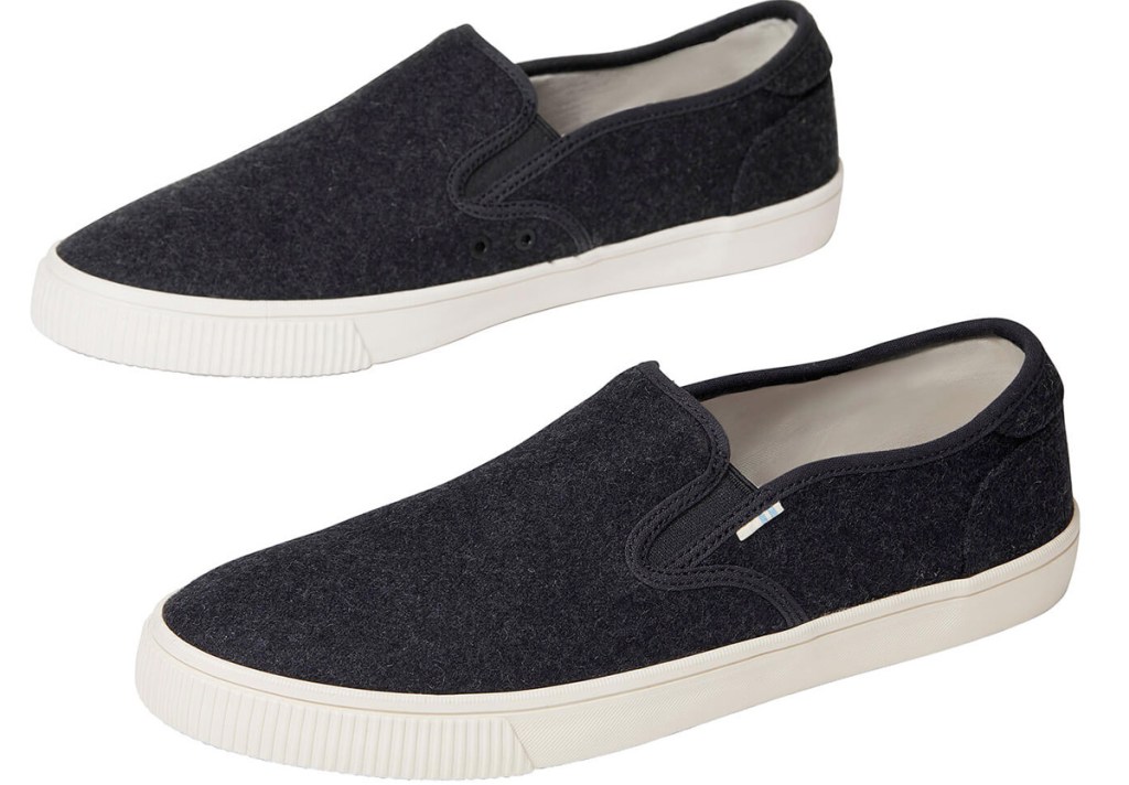 pair of black felt slip-on shoes with white rubber soles