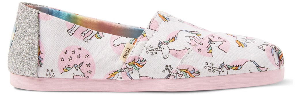 white and pink toms slip on shoes with unicorn print and silver glitter at heel