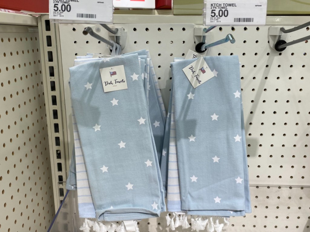 blue dish towels with white stars hanging in store