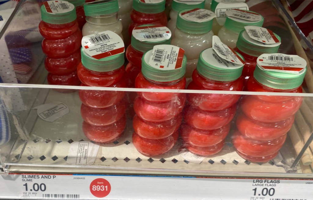 bottles of red and white slime on store shelf