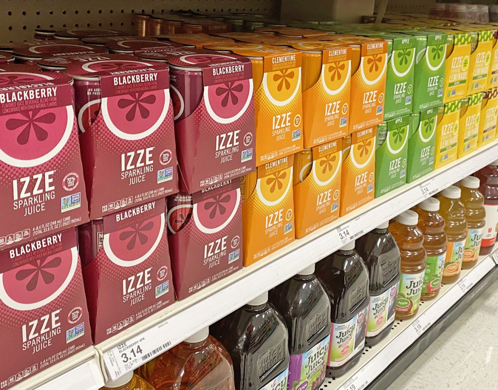 4-pack boxes of izze sparkling drinks in various flavors on store shelf