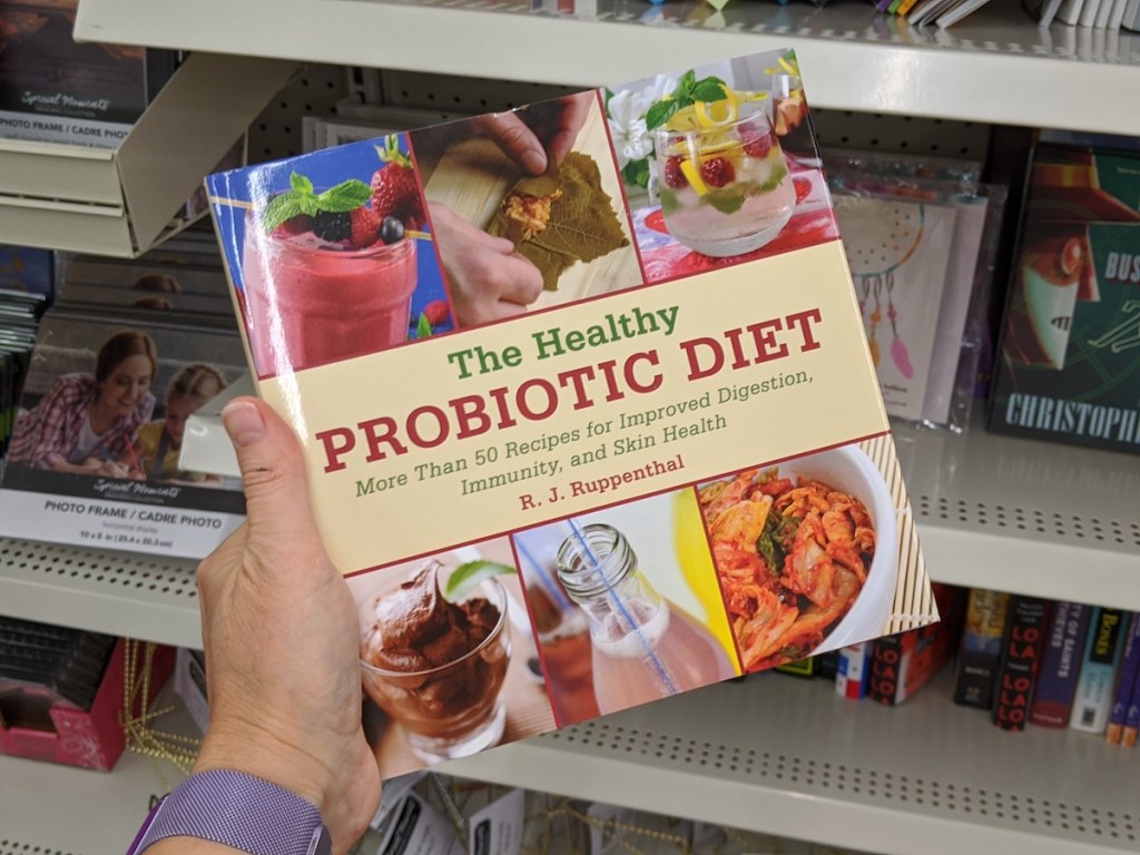 hand holding a The Healthy Probiotic Diet book