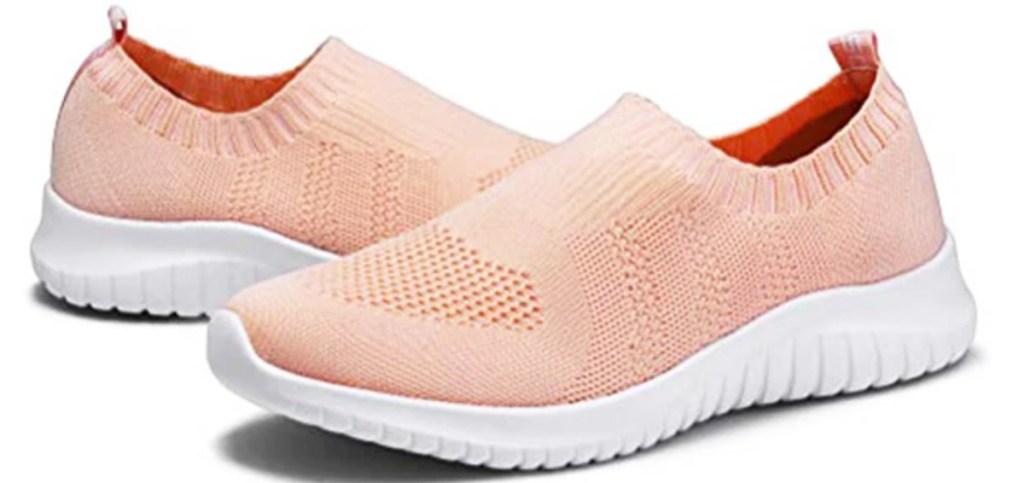 light pink pair of knit slip-on shoes with white soles