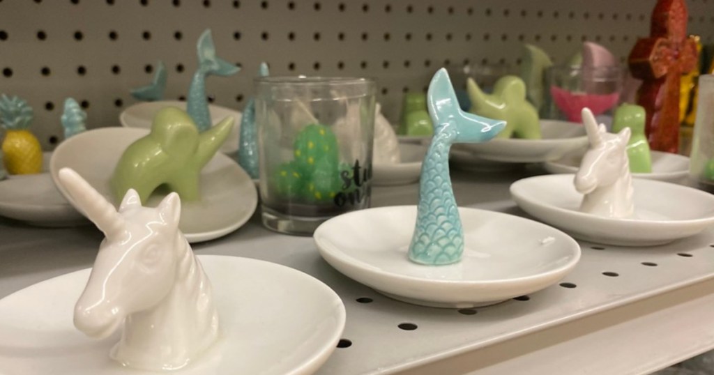 unicorn and mermaid tail ring trays on store shelf