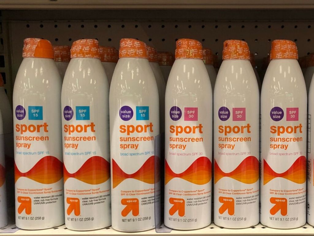 shelf of large bottle of spray sunscreen