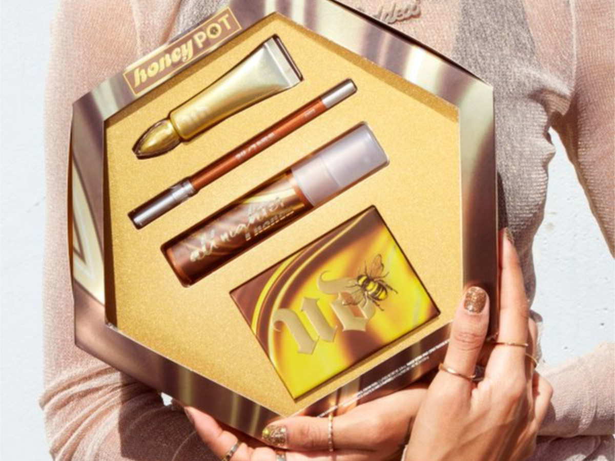 woman holding makeup set in hands