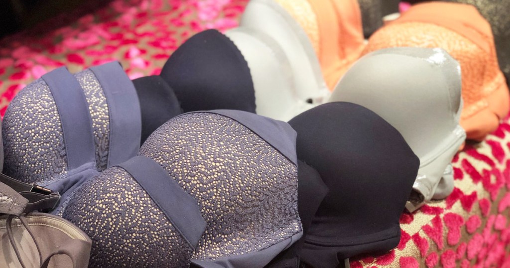 various colors of bras laying on store display table