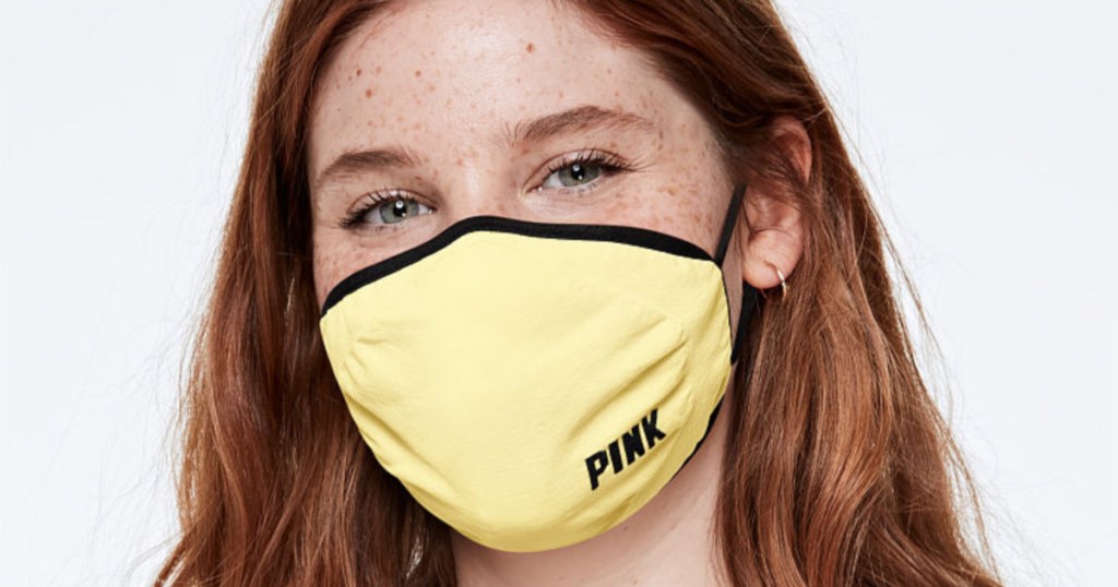 girl wearing victoria's secret pink yellow face mask