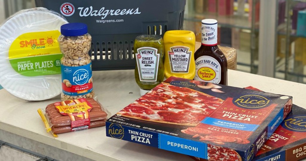 pizzas, paper plates, buts, condiments on a Walgreens counter