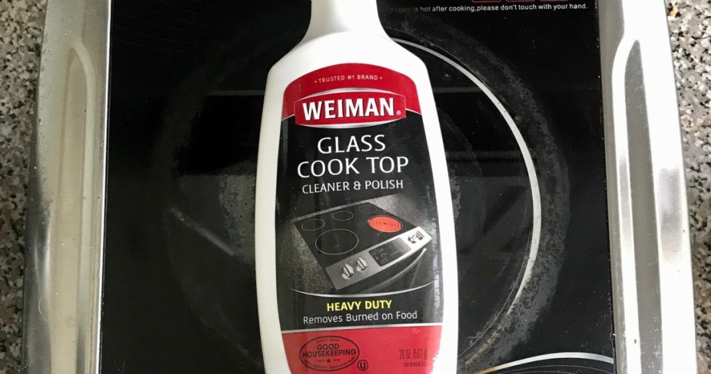 bottle of glass cleaner and polish on black stove top