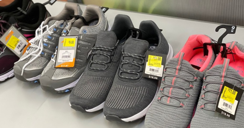 four pairs of women's sneakers on table in store