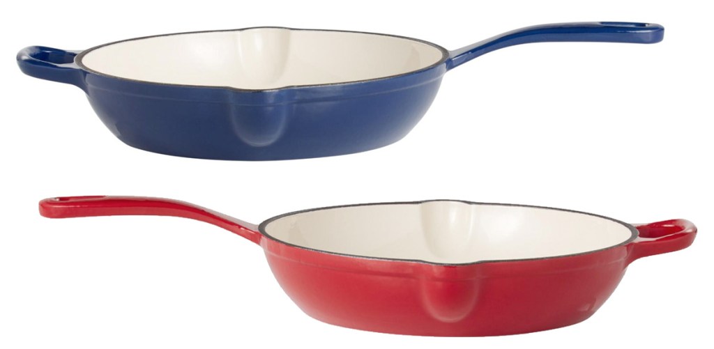 two enamel cast iron pans in blue and red with white interiors