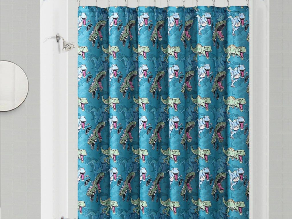 dino themed shower curtain in bathroom