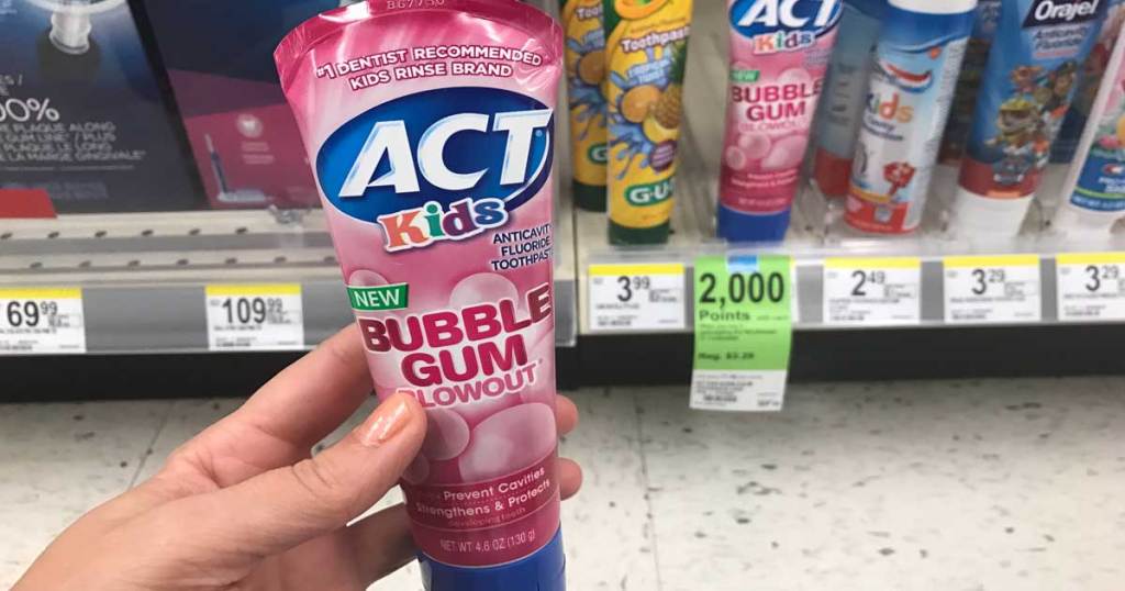 Act Kids Bubblegum Toothpaste held up in woman's hand