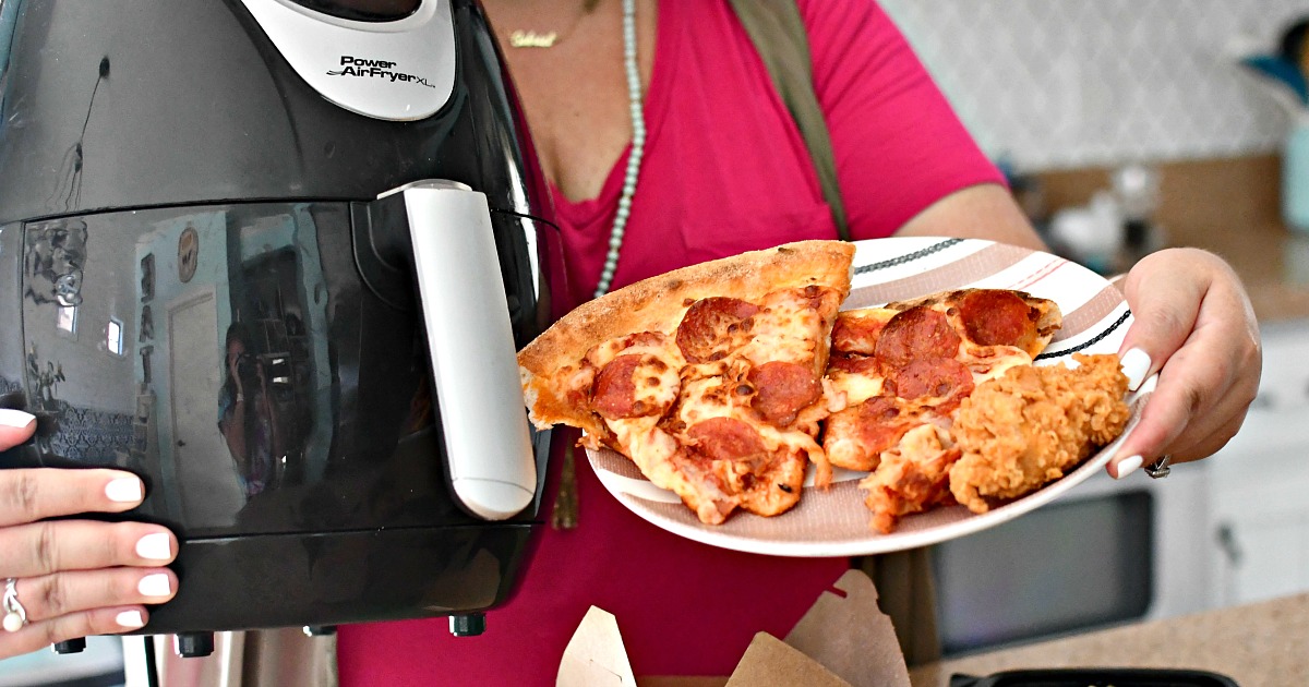 air fryer next to pizza and chicken tenders