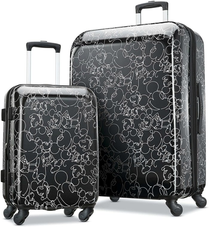 stock image of two pieces of luggage with black and white mickey mouse designs