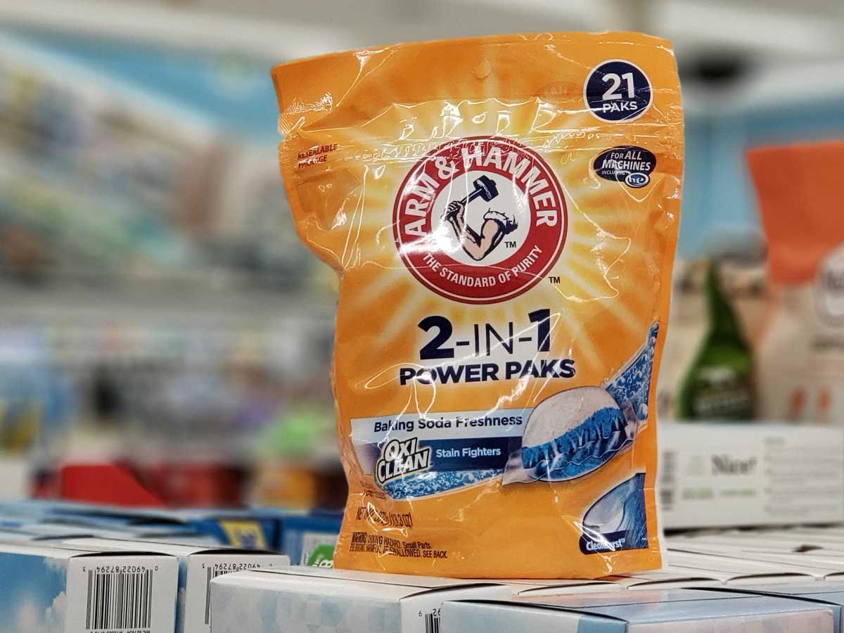 bag of arm & hammer laundry pacs sitting on packages on a store shelf