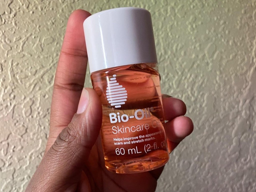hand holding Bio Oil