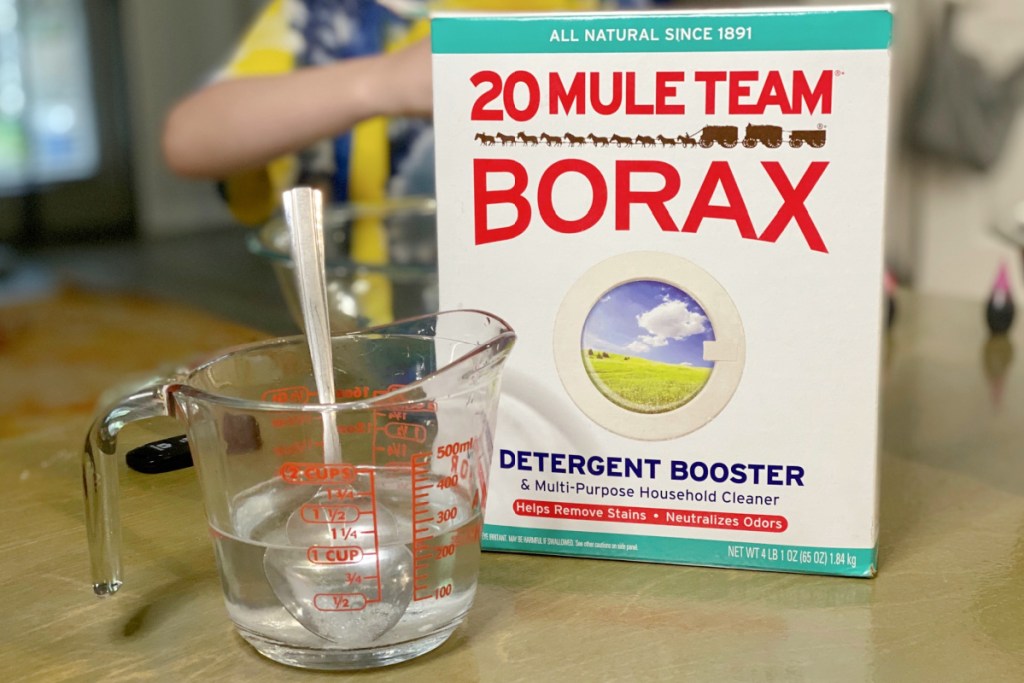 Box of Borax on counter beside measuring cup