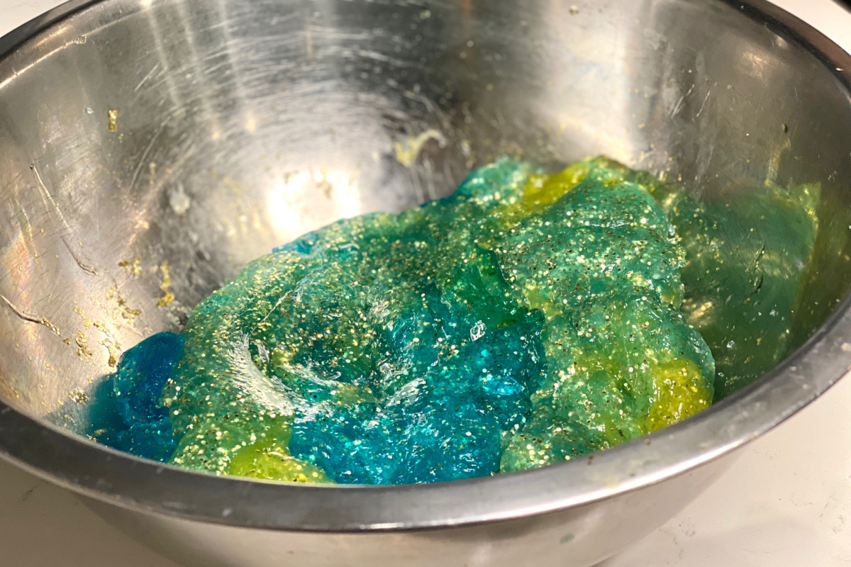 slime with sparkles mixed together in bowl