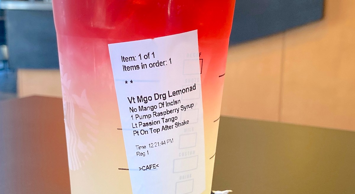 red and white ombre Starbucks firecracker drink with ingredients sticker on cup
